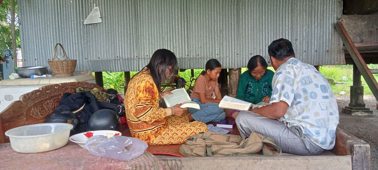 Discipling and praying with a family in Chhuk