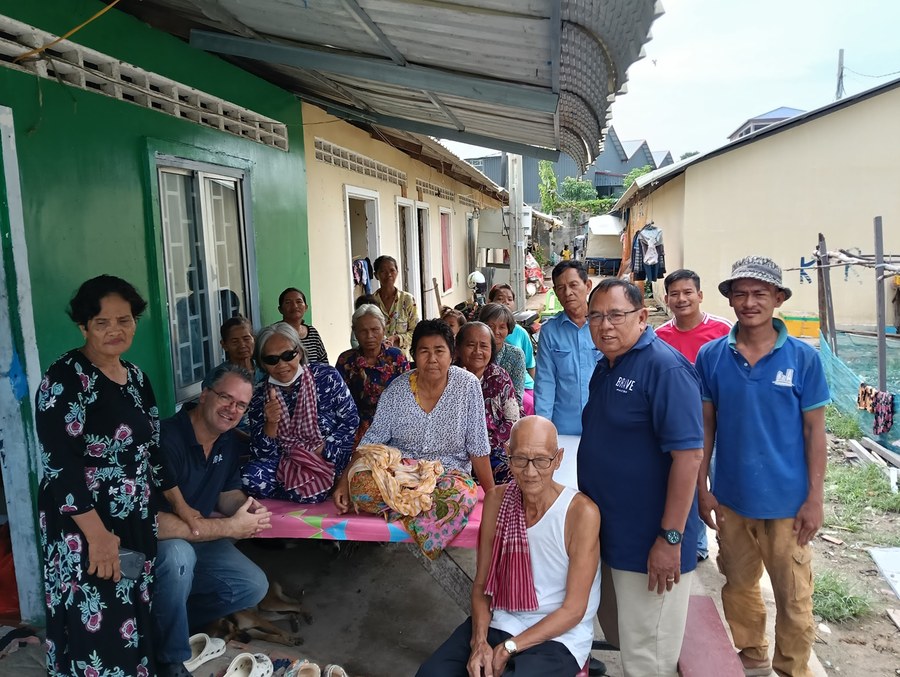 Praying with a family in Chouk Va Mouy