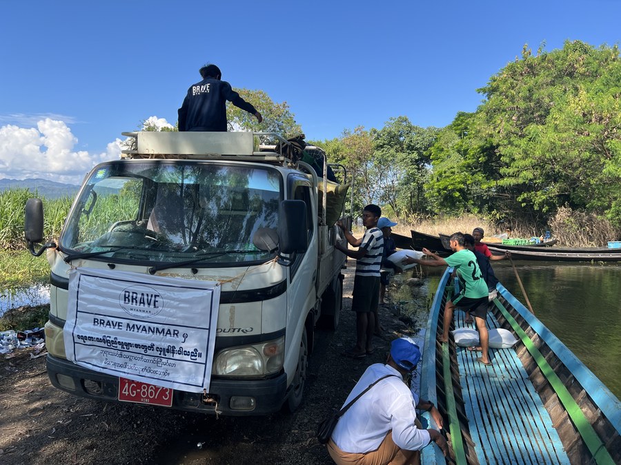 BRAVE Myanmar truck loading relief supplies near the river