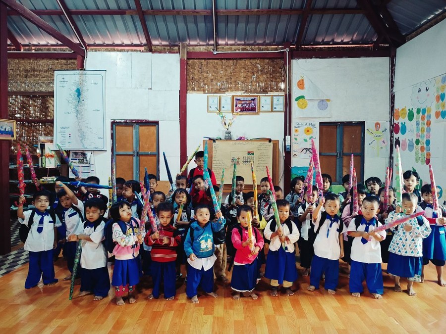 Grace Preschool children holding colorful decorated banners